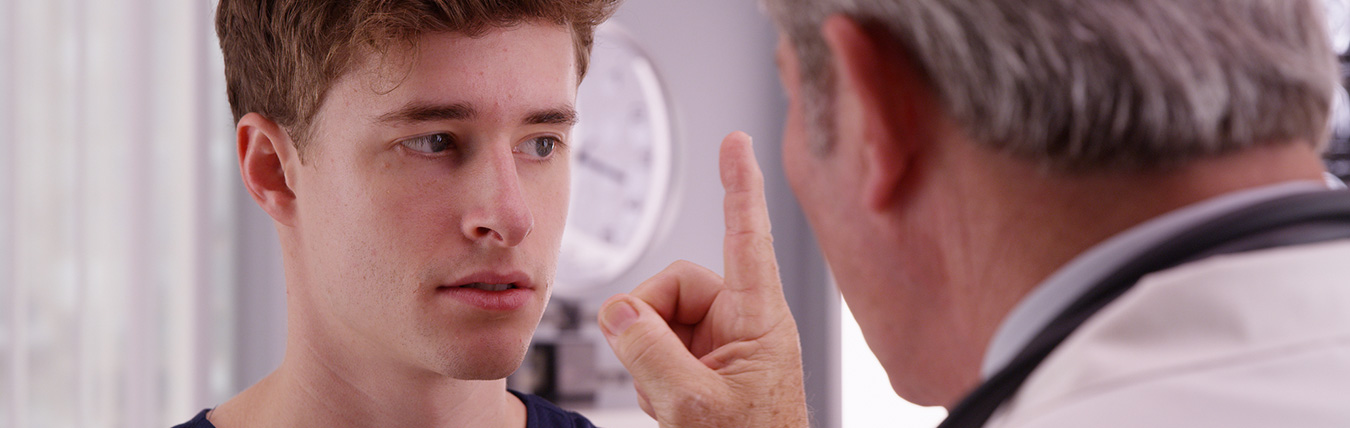 Man being examined visually.