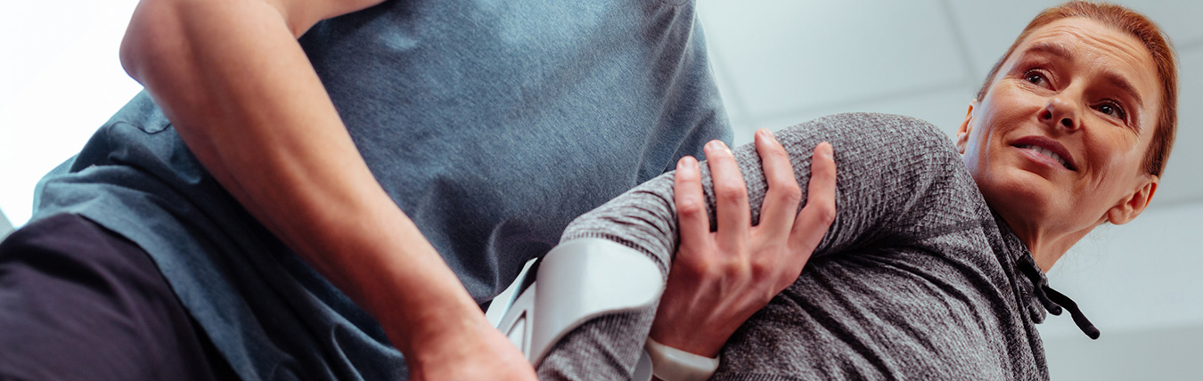 Woman being helped in therapy.