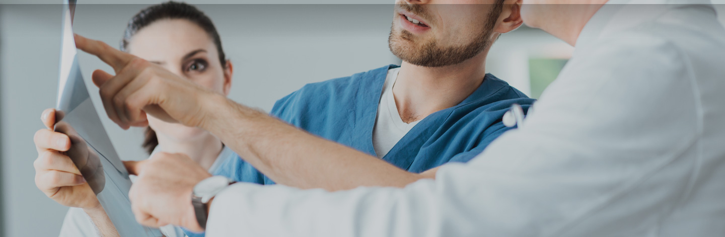 Close up of Doctors looking at paper.
